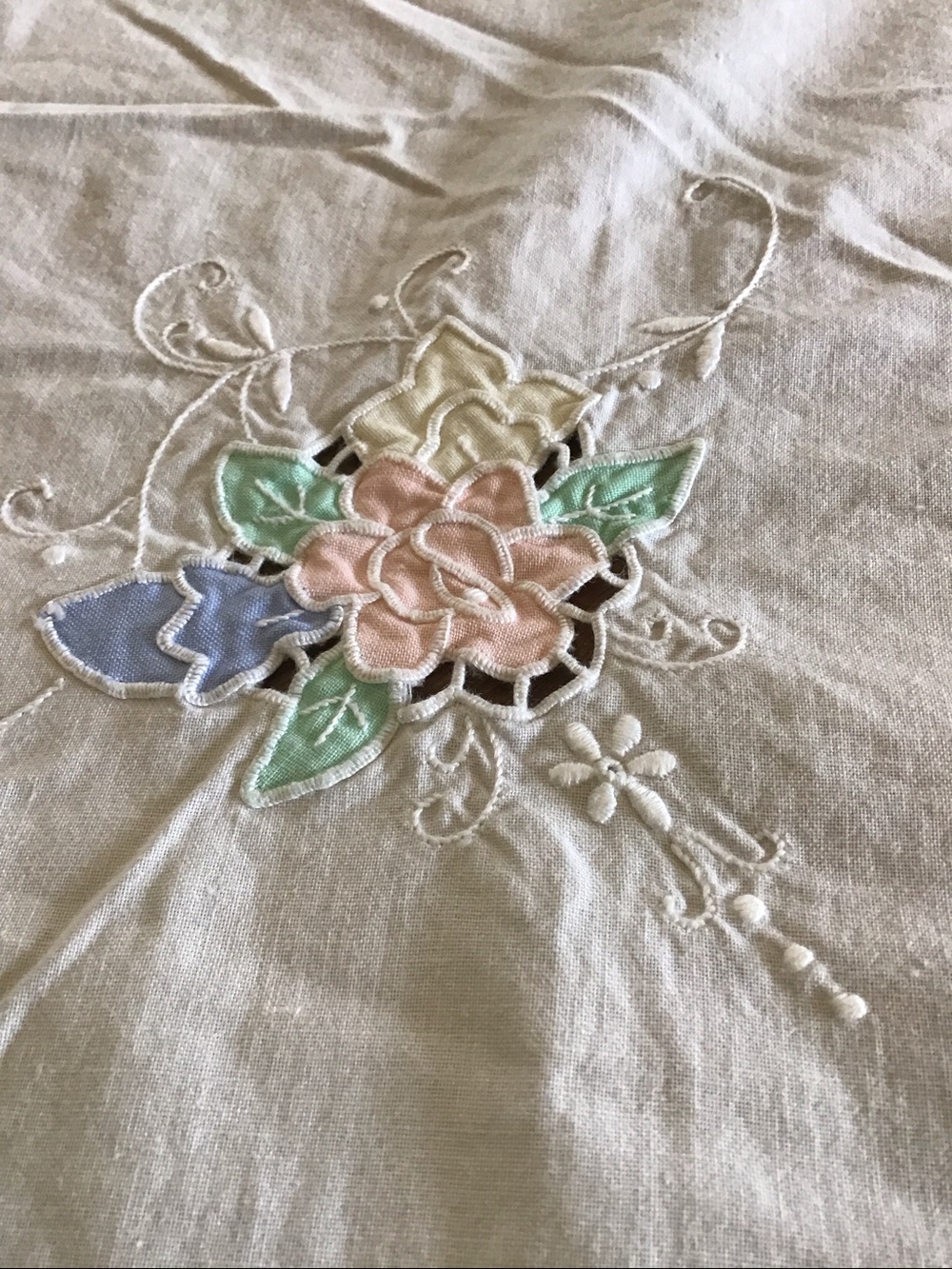 Delicate pastel embroidered tablecloth